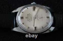 Montre Calendrier Genivere 17 Rubis Chrome et Cadran Gris Suisse Fabriqué Classique Vintage