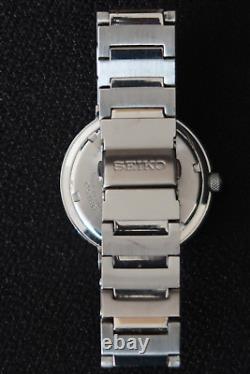 Montre à Quartz Seiko V732 0p20 Cadran Blanc et Chrome Bracelet en Acier Inoxydable Une Beauté