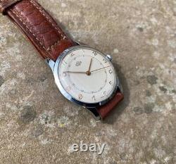 Montre ancienne Timor/Derrick pour homme datée de 1967. État impeccable