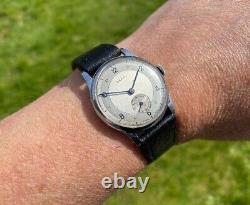 Montre vintage pour homme Lanco cadran bicolore type militaire des années 1950